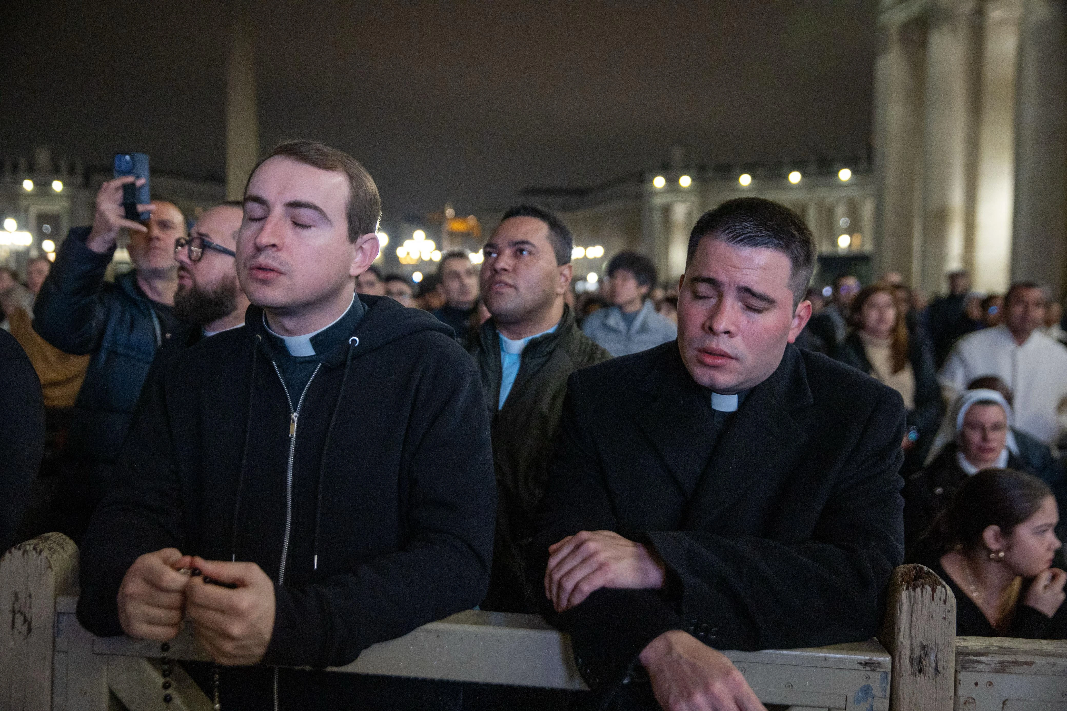 Clergy pray the rosary for Pope Francis’ recovery on Feb. 24, 2025, in St. Peter's Square. Credit: Daniel Ibañez/CNA