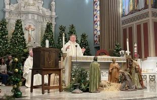 From left to right: Auxiliary Bishop of the Our Lady of the Angels Pastoral Region Matthew G. Elshoff, St. Monica pastor Father Lloyd Torgerson, and Corpus Christi pastor Monsignor Liam Kidney celebrate Mass at St. Monica Church with Corpus Christi’s surviving tabernacle next to the altar on Jan. 12, 2025. Credit: Paul Escala