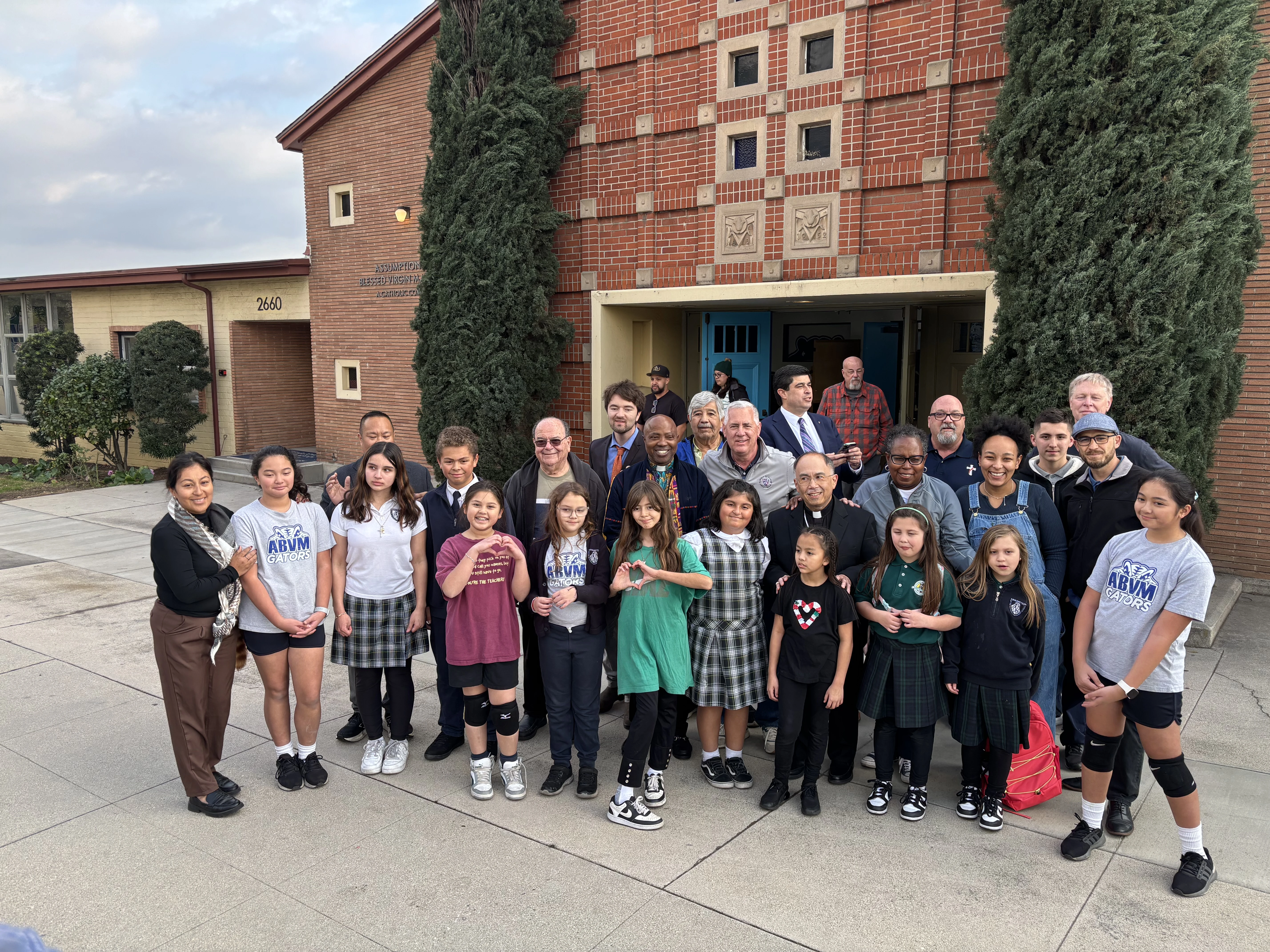 Community members at Assumption of the Blessed Virgin Mary Church in Los Angeles turn out to unload a truck of supplies from Kansas on Jan. 28, 2025.?w=200&h=150