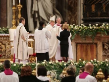 Pope Francis administers confirmation during the Easter Vigil Mass in St. Peter's Basilica, April 4, 2015.