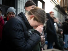 A young woman prays the rosary in front of the Planned Parenthood facility on Bleecker Street in Manhattan in an undated photo.