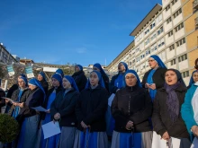 Religious sisters pray the rosary for Pope Francis outside Rome’s Gemelli Hospital on Saturday, Feb. 22, 2025.
