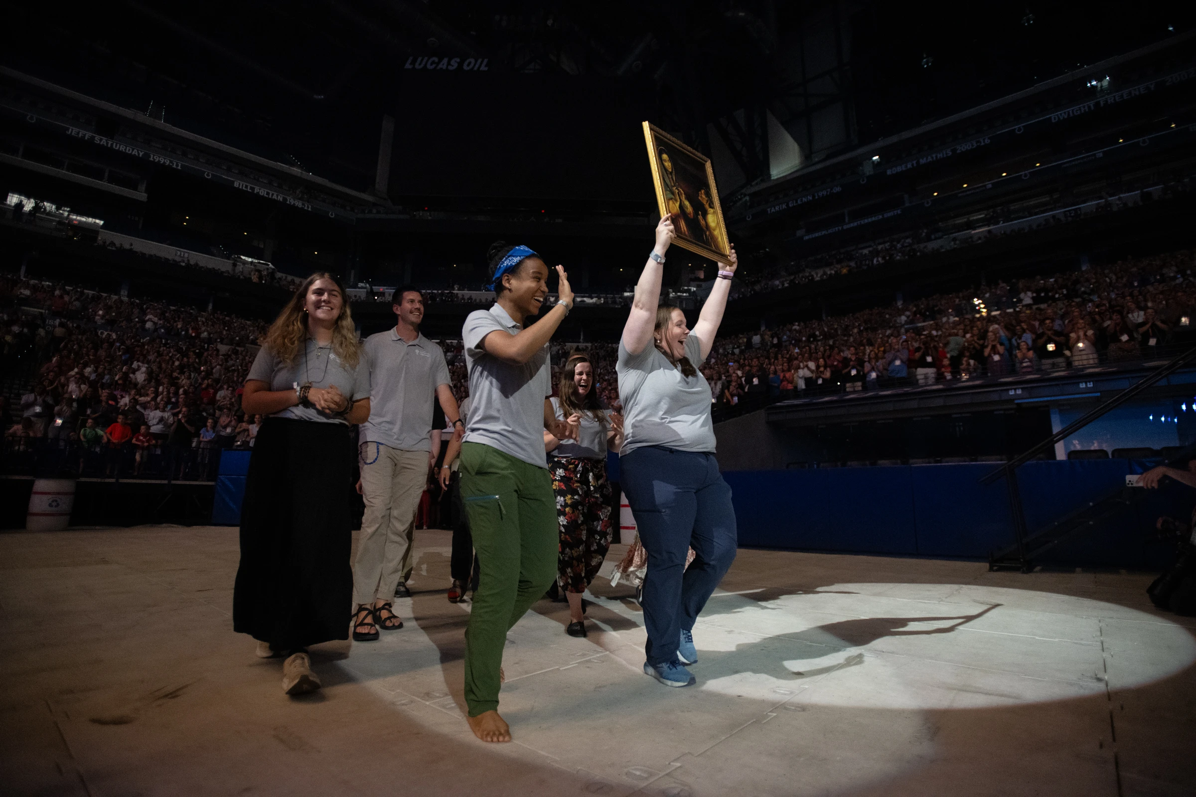 Perpetual Pilgrims from the St. Juan Diego Route process into Lucas Oil Stadium in July 2024 with an image of their patron saint.?w=200&h=150