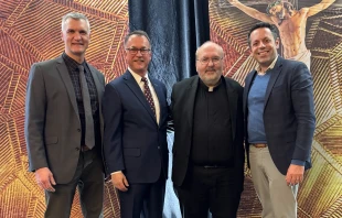 Left to right: Jason Simon, president, The Evangelical Catholic; Joe Adams, winner of the ad extra award; Father Paul Soper, secretary for ministerial personnel and director of clergy personnel, Archdiocese of Boston, winner of the ad intra award; and Dan Cellucci, CEO of Catholic Leadership Institute Credit: Kelly Czajka