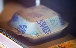 A vintage McDonald’s Filet-O-Fish container with blue and green branding. Credit: Karolis Kavolelis/Shutterstock