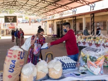 Catholic Relief Services distributes food for school children at one of the schools in the Department of Totonicapán, Guatemala, with the help of parent volunteers.