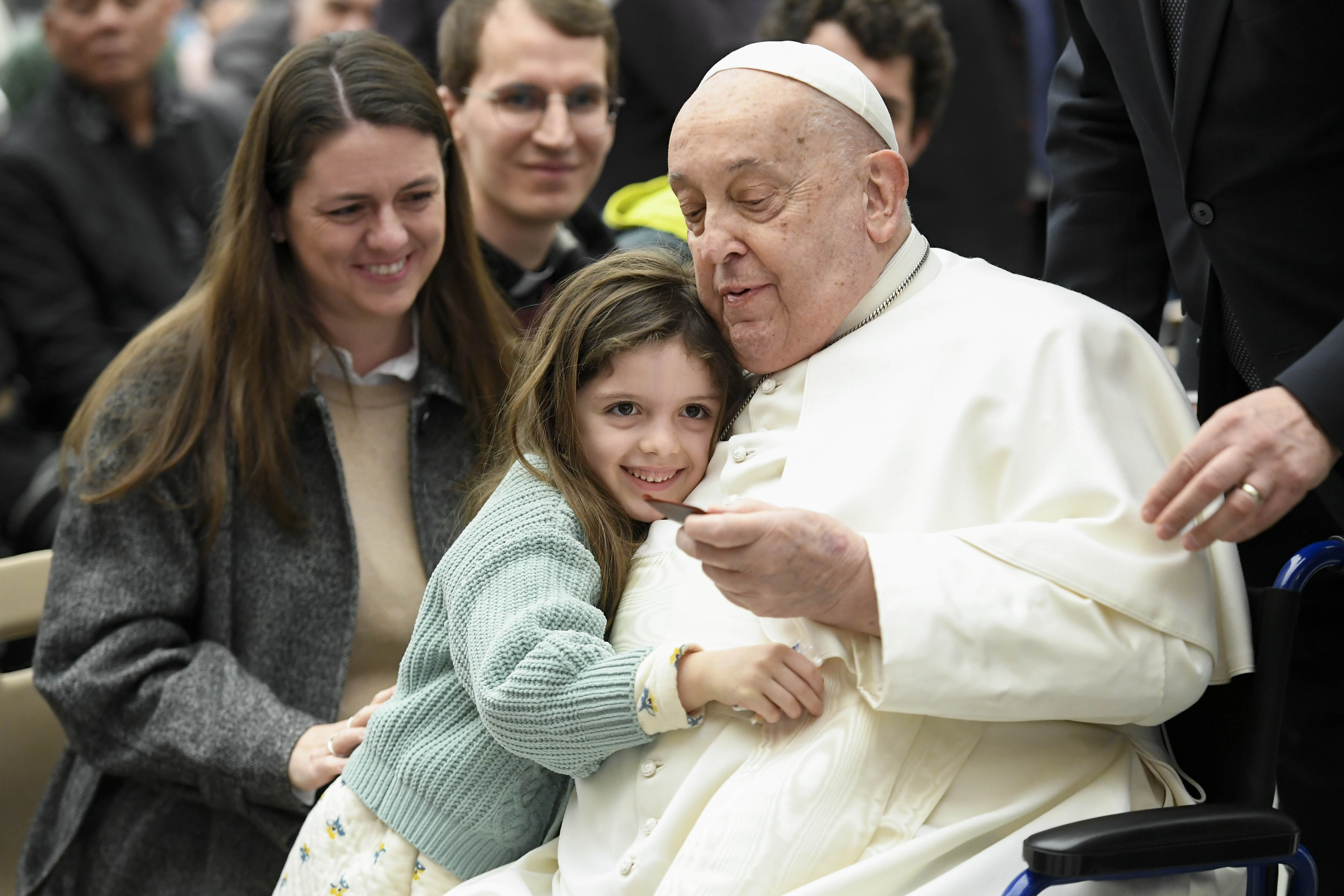 Pope Francis is hugged by a young visitor at his general audience at the Vatican, Wednesday, Feb. 12, 2025.?w=200&h=150
