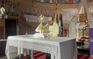 Father Gabriel Romanelli, pastor of Holy Family Parish in Gaza, leads Eucharistic adoration at the parish in December 2024. Credit: Photo courtesy of Father Gabriel Romanelli