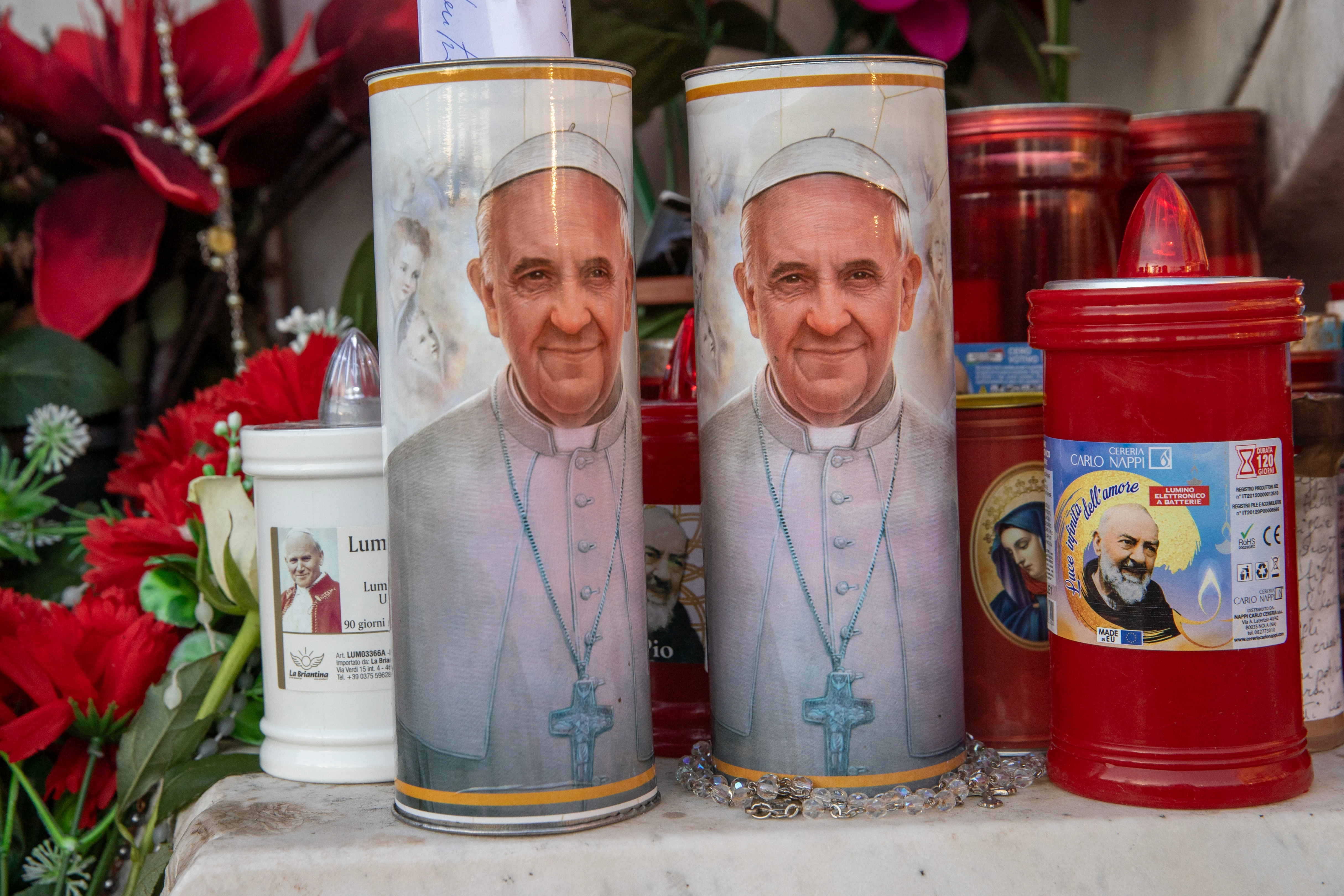 Candles with Pope Francis’ image on them stand outside Gemelli Hospital in Rome on Feb. 21, 2025. Credit: Daniel Ibañez/CNA