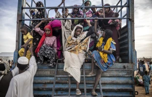 Sudanese refugees who have fled from the war in Sudan get off a truck loaded with families arriving at a transit center for refugees on Feb. 13, 2024. Credit: LUIS TATO/AFP via Getty Images