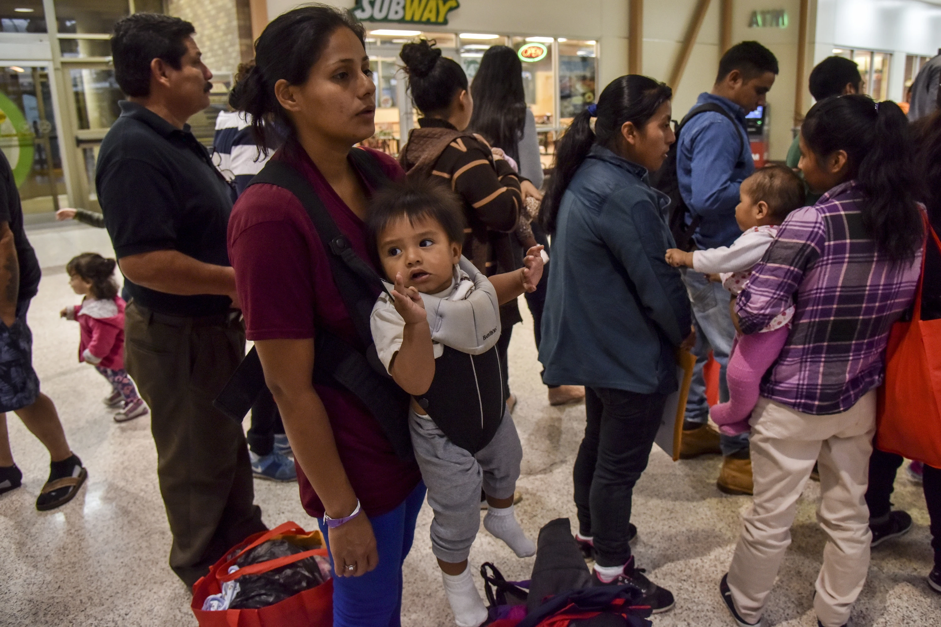After receiving assistance from the Catholic Charities RGV Humanitarian Respite Center, migrant families from Mexico and Central America who have been released into the United States are processed for their transport to various destinations across the United States from the at the Central Station Bus Terminal on June 19, 2018, in McAllen, Texas.?w=200&h=150