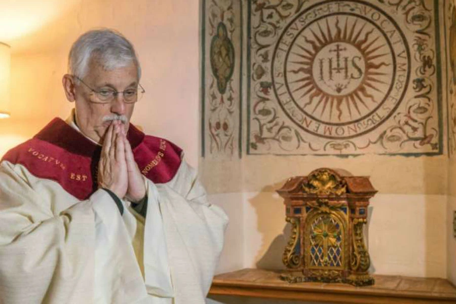 Father Arturo Sosa, superior general of the Society of Jesus, prepares to celebrate Mass at the Gesu in Rome on Oct. 15, 2016.?w=200&h=150