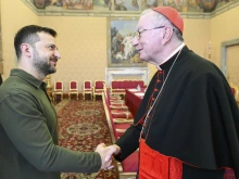 Ukraine President Volodymyr Zelenskyy shakes hands with Vatican Secretary of State Cardinal Pietro Parolin during a meeting at the Vatican on Friday, Oct. 11, 2024.