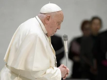 Pope Francis prays during his Wednesday general audience on Feb. 5, 2025, in the Paul VI Audience Hall at the Vatican.