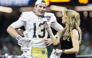 ESPN reporter Molly McGrath interviews Notre Dame quarterback Riley Leonard (13) after NCAA football game action between the Notre Dame Fighting Irish and the Georgia Bulldogs at Caesars Superdome in New Orleans, on Jan. 2, 2025. “First and foremost I want to thank my lord and savior Jesus Christ,” Leonard told the media. Credit: John Mersits/Cal Sport Media via AP Images