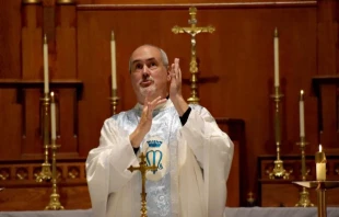 Father Mike Depcik, one of the few Deaf priests in the world, signs a Catholic Mass in American Sign Language. Credit: Photo courtesy of Father Mike Depcik