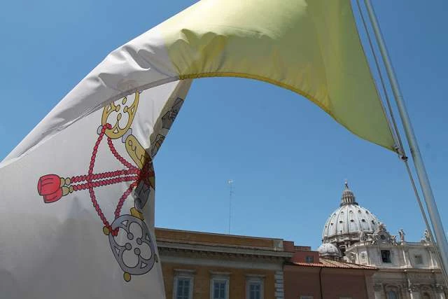 A Vatican flag waves over the dome of St. Peter’s Basilica.?w=200&h=150