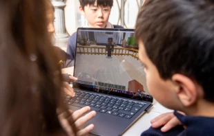 Students try out the new Minecraft Education experience “Peter Is Here: AI for Cultural Heritage” during a press conference unveiling the project on March 18, 2025, at the Vatican. Credit: Daniel Ibañez/CNA