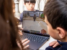 Students try out the new Minecraft Education experience “Peter Is Here: AI for Cultural Heritage” during a press conference unveiling the project on March 18, 2025, at the Vatican.