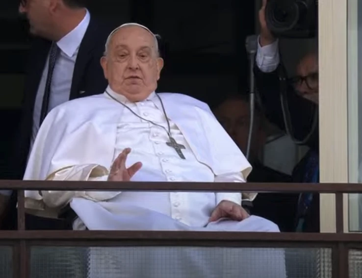 Pope Francis waves from a balcony at Gemelli Hospital in Rome on Sunday, March 23, 2025, following weeks of hospitalization for bilateral pneumonia.?w=200&h=150