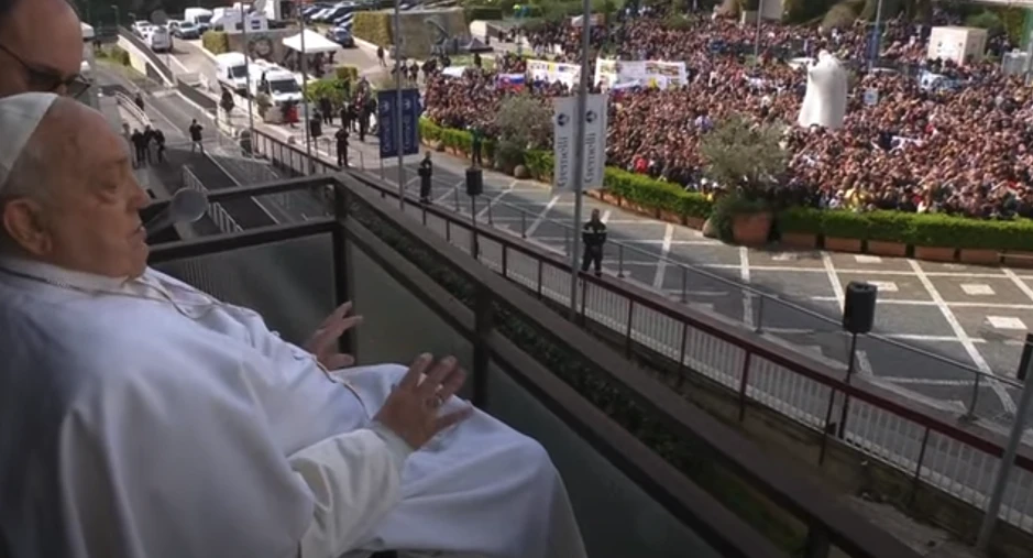 Pope Francis waves to the gathered faithful from the balcony at Gemelli Hospital in Rome on Sunday, March 23, 2025. | Credit: Vatican Media/Screenshot