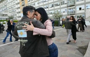 Daiana Guspero and Massimiliano Varrese dance tango in the plaza outside Gemelli Hospital on March 16, 2025. Credit: Courtesy of Daiana Guspero
